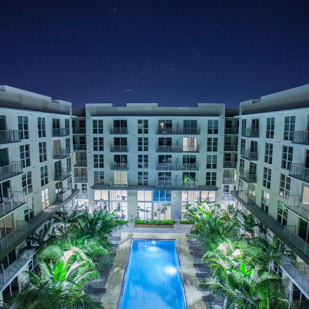 Luxury apartment night pool aerial view